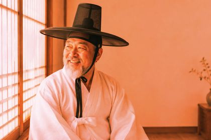 Overlay with #e8743b on the hanbok-portrait photo