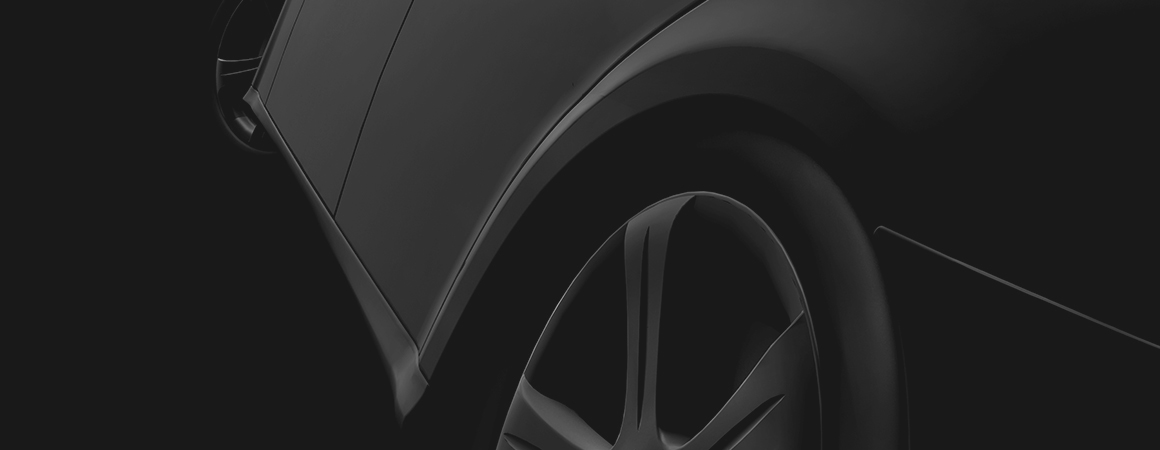 Matte black sports car, rear quarter view